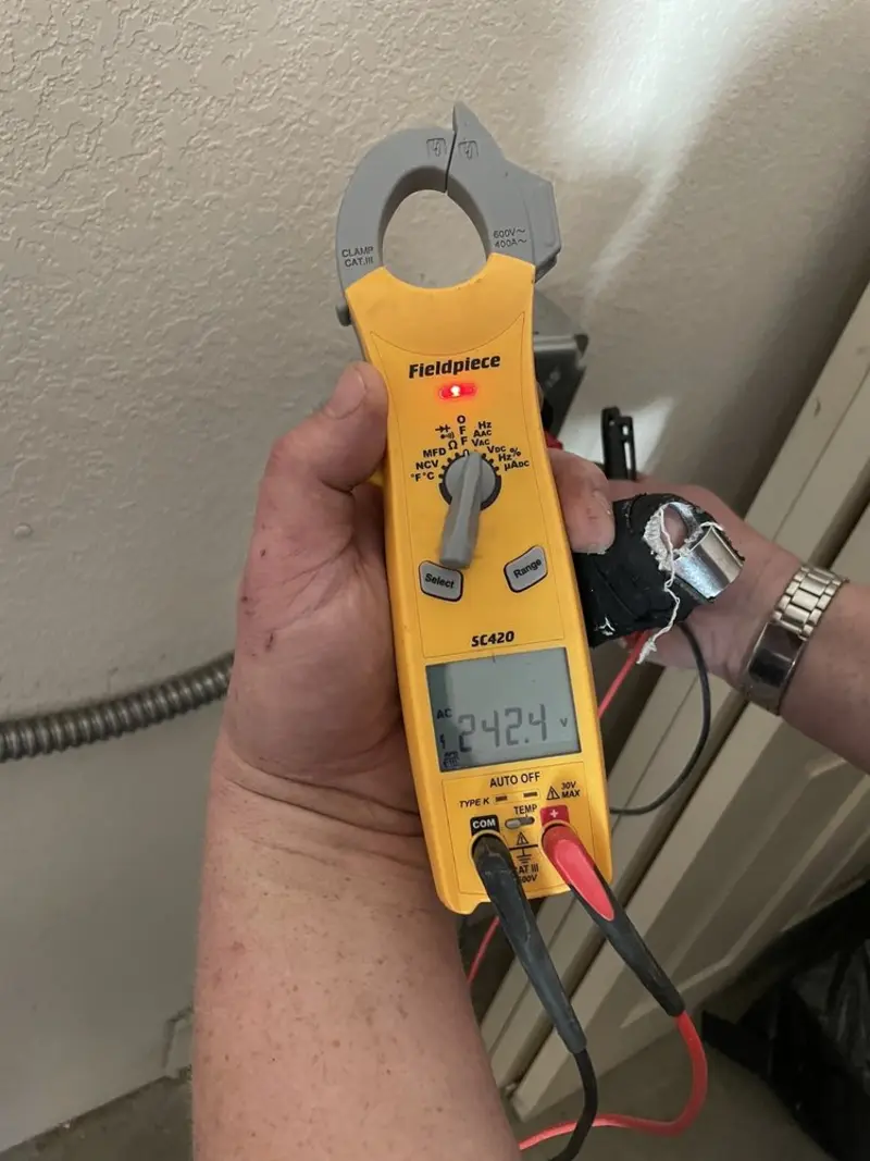 Voltage testing with clamp meter during Outlet Installation in Vado